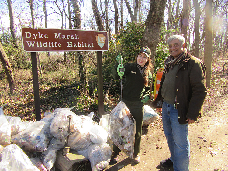 NPS volunteer coordinator Trudy Roth and FODMer Clarence Monteiro weighed the trash bags