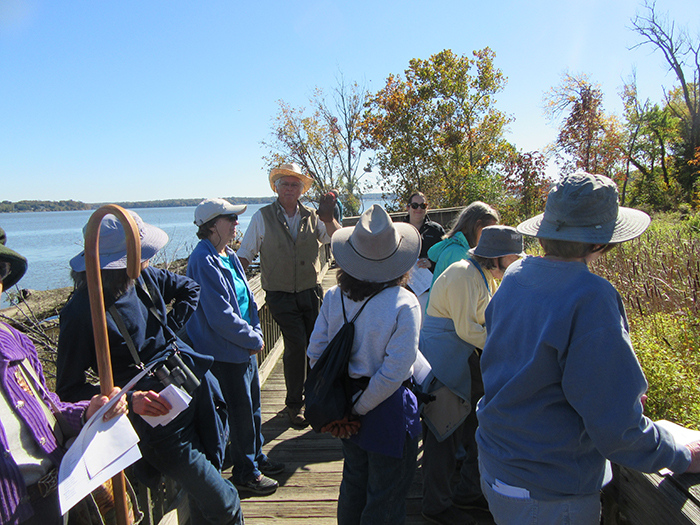 October 23 attendees and co leader Alan Ford studying plants from the boardwalk